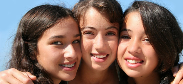 three girls smiling