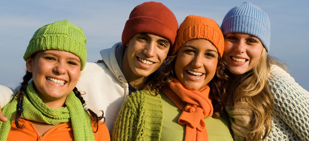 four people smiling