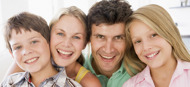 family of four smiling